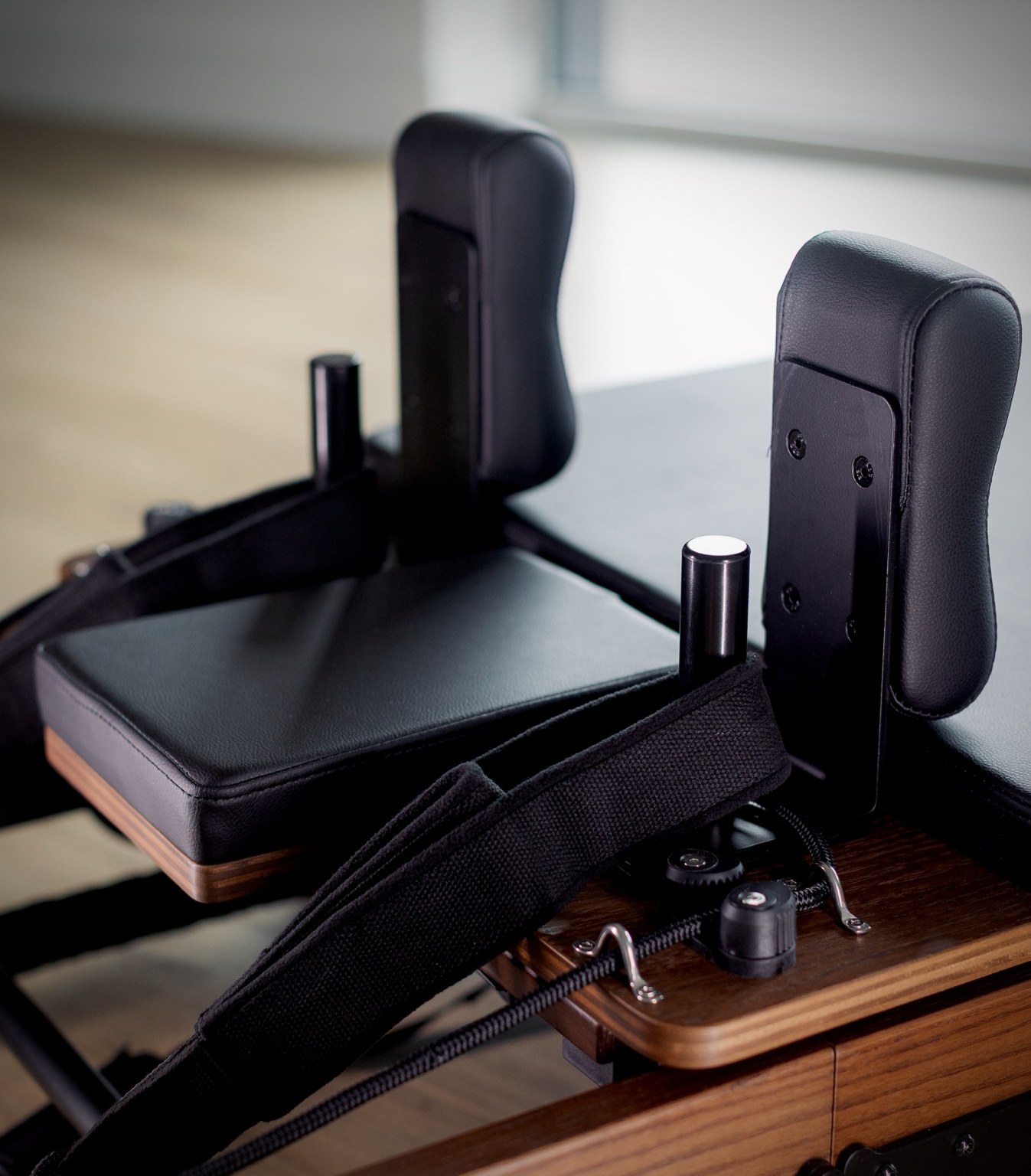 Reformer shoulder rests and straps