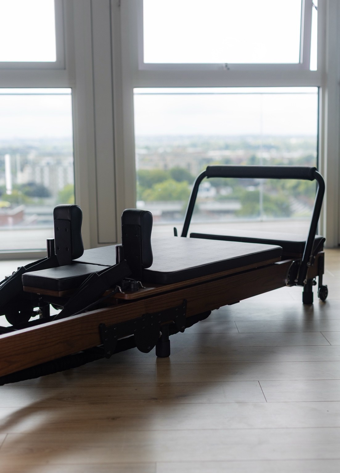 Pilates reformer by the studio windows